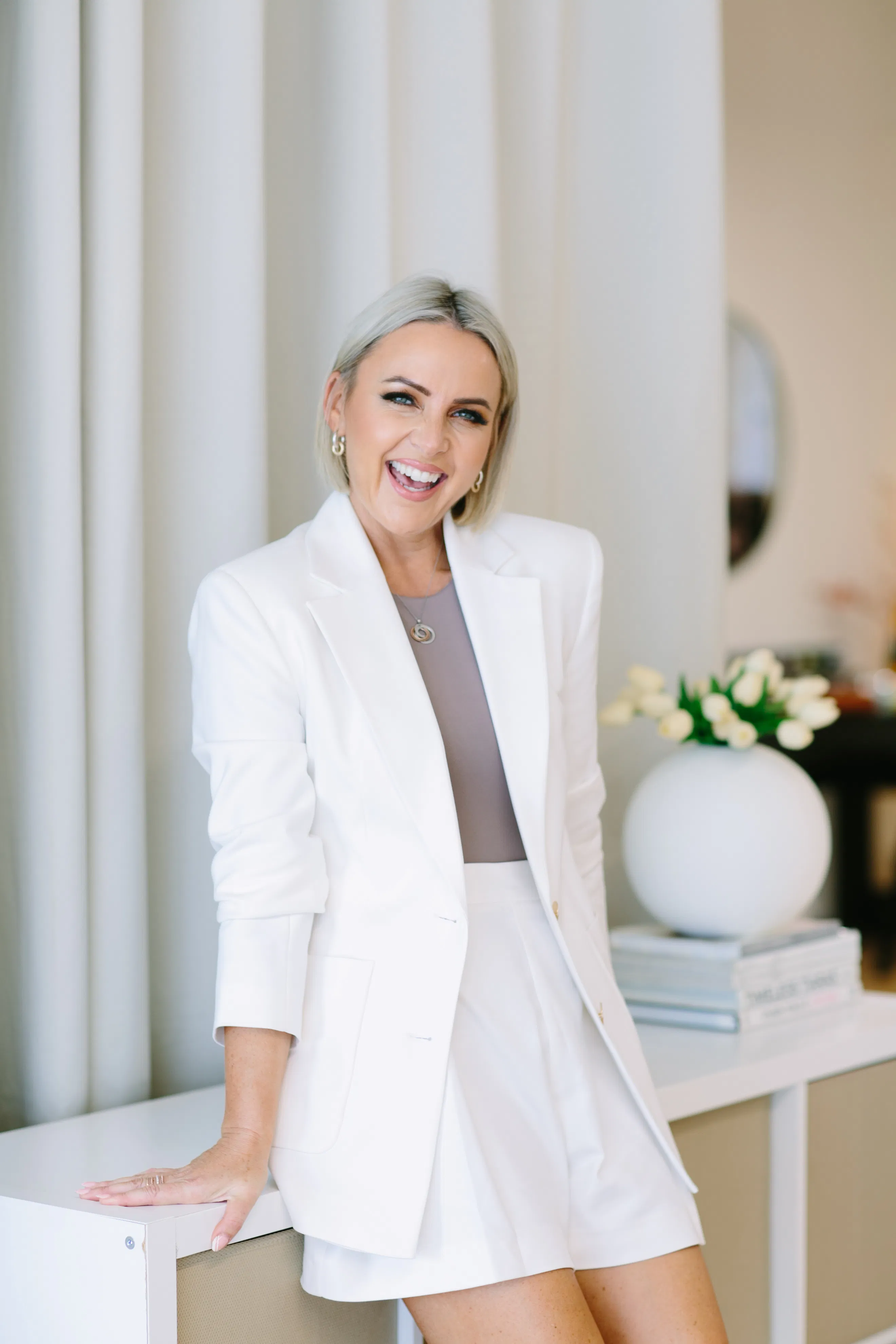Kelly Lundberg, personal brand strategist, in a white suit